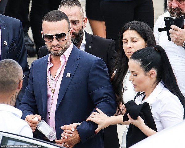 24532220-7985737-Danny_Abdallah_holds_the_hand_of_his_wife_Leila_as_they_farewell-a-36_1581312088691.jpg,0