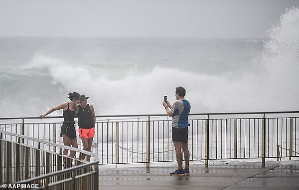 24548536-7986575-People_watch_rough_ocean_conditions_at_Bronte_Beach_in_Sydney_on-a-6_1581352061633.jpg,0