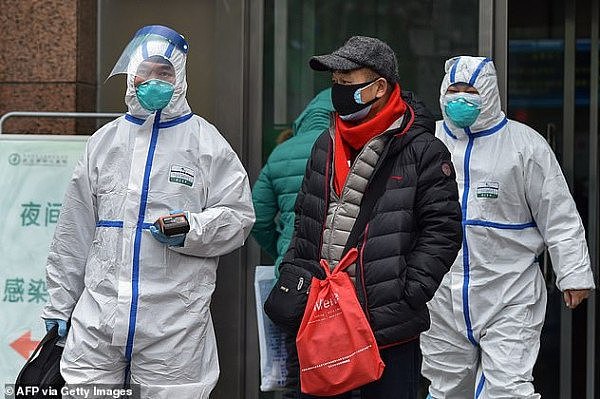 23887366-7966887-Medical_staff_are_seen_wearing_protective_clothing_outside_a_hos-a-1_1580852332264.jpg,0