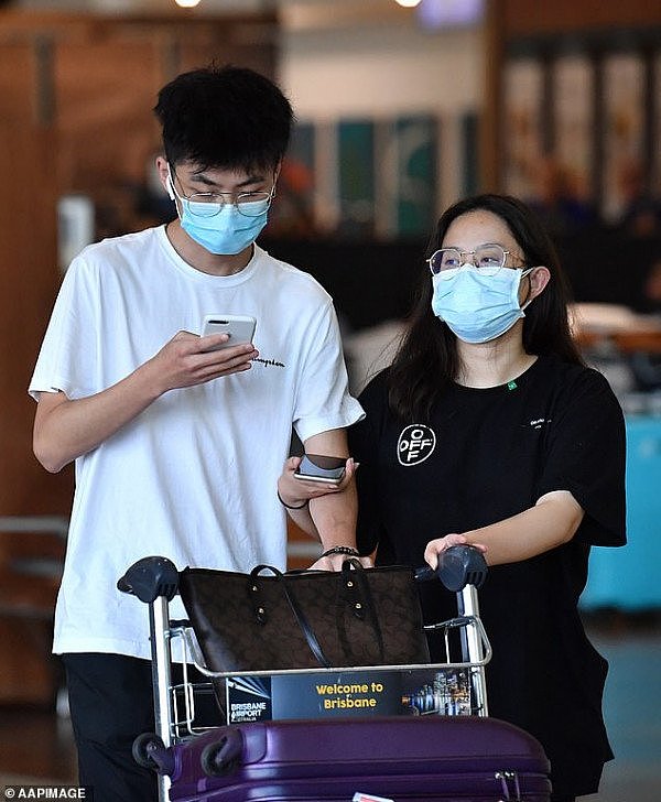 24967990-8067721-Travellers_are_pictured_wearing_protective_face_masks_at_Brisban-a-31_1583199380071.jpg,0