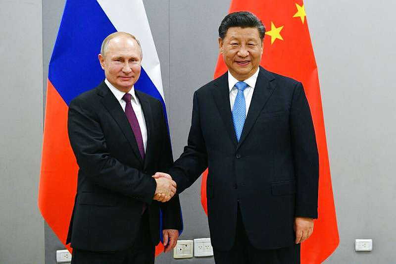 俄罗斯总统普京与中国国家主席习近平。 （美联社）
