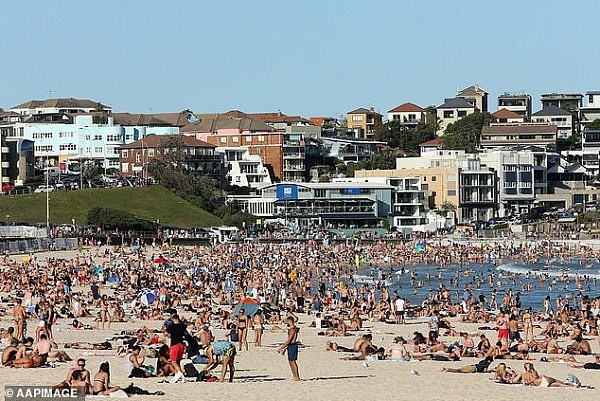 26231434-8139105-Beachgoers_are_seen_at_Bondi_Beach_on_Friday_pictured_despite_th-a-18_1584845400897.jpg,0