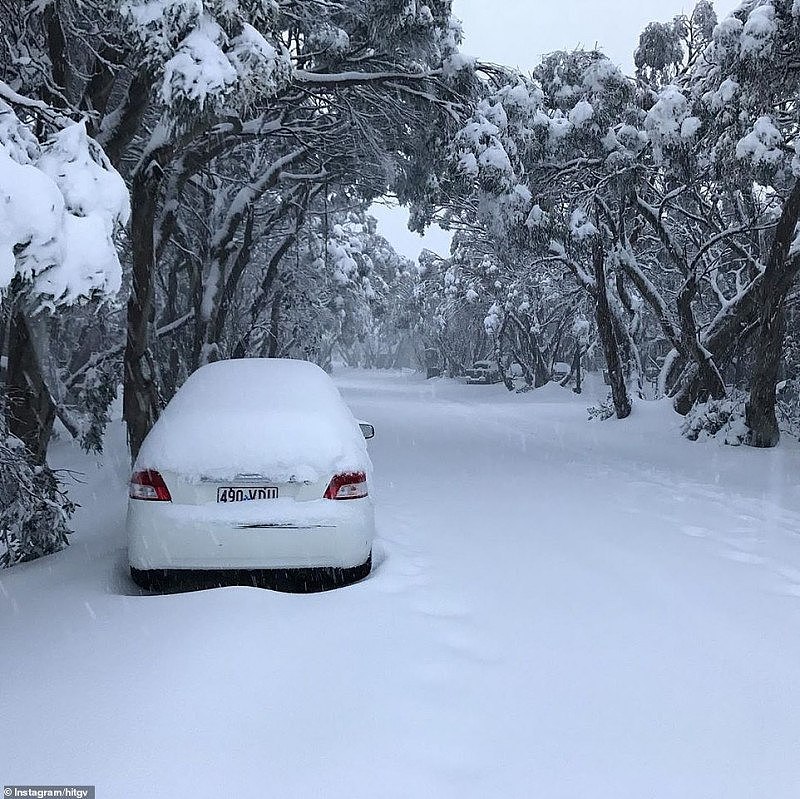 27865200-8275951-Snow_blankets_a_road_in_Mount_Buller_in_Victoria_with_footprints-a-5_1588296275785.jpg,0