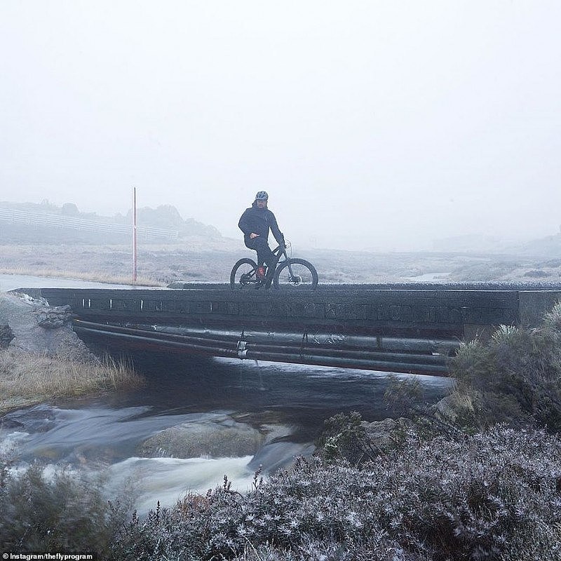 27868376-8275951-A_man_goes_for_a_cycle_in_Thredbo_on_Day_Two_of_the_snow_bomb_Th-a-7_1588296275789 (1).jpg,0