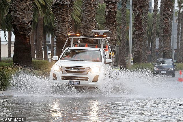 28791458-8367649-A_utility_vehicle_navigates_through_flood_waters_on_Monday_in_Pe-a-5_1590708487273.jpg,0