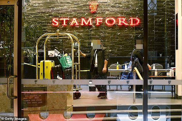 30275322-8485437-Staff_inside_the_Stamford_Hotel_in_Melbourne_are_seen_moving_lug-a-29_1593736640017.jpg,0