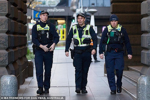 30552498-8504273-Police_patrol_the_streets_of_Melbourne_on_Thursday_after_city_en-a-15_1594256551176.jpg,0