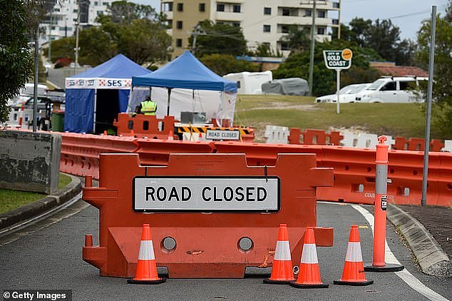 31047600-8547661-Barricades_have_been_installed_along_some_of_Coolangatta_s_stree-a-3_1595404242678.jpg,0