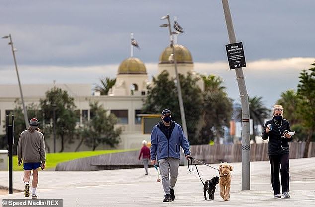 31130852-8554987-People_seen_wearing_masks_in_St_Kilda_as_the_Victorian_Premier_c-a-7_1595573152418.jpg,0