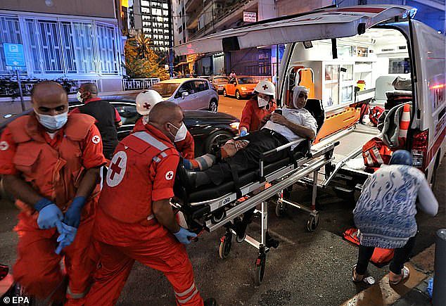 31565400-8594263-Medics_shift_an_injured_person_from_Najjar_Hospital_to_another_h-a-58_1596595549485.jpg,0