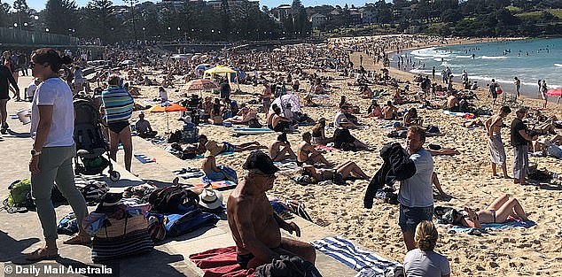 32555004-8707903-Hundreds_of_sunbathers_flocked_to_Sydney_beaches_on_Sunday_to_so-a-38_1599527076168.jpg,0