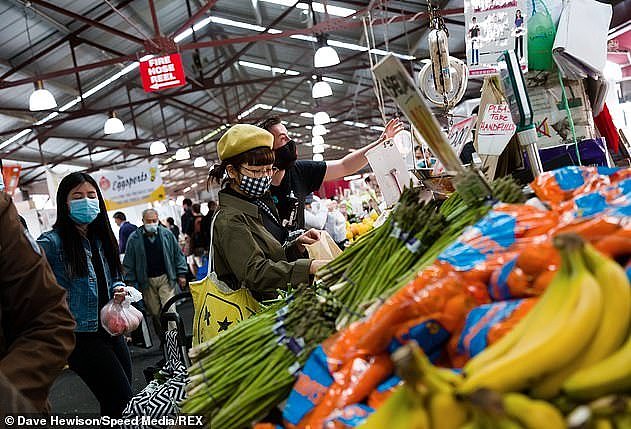 34267764-8829229-Locals_are_seen_shopping_for_fresh_food_in_the_Queen_Victoria_Ma-a-8_1602463888762.jpg,0