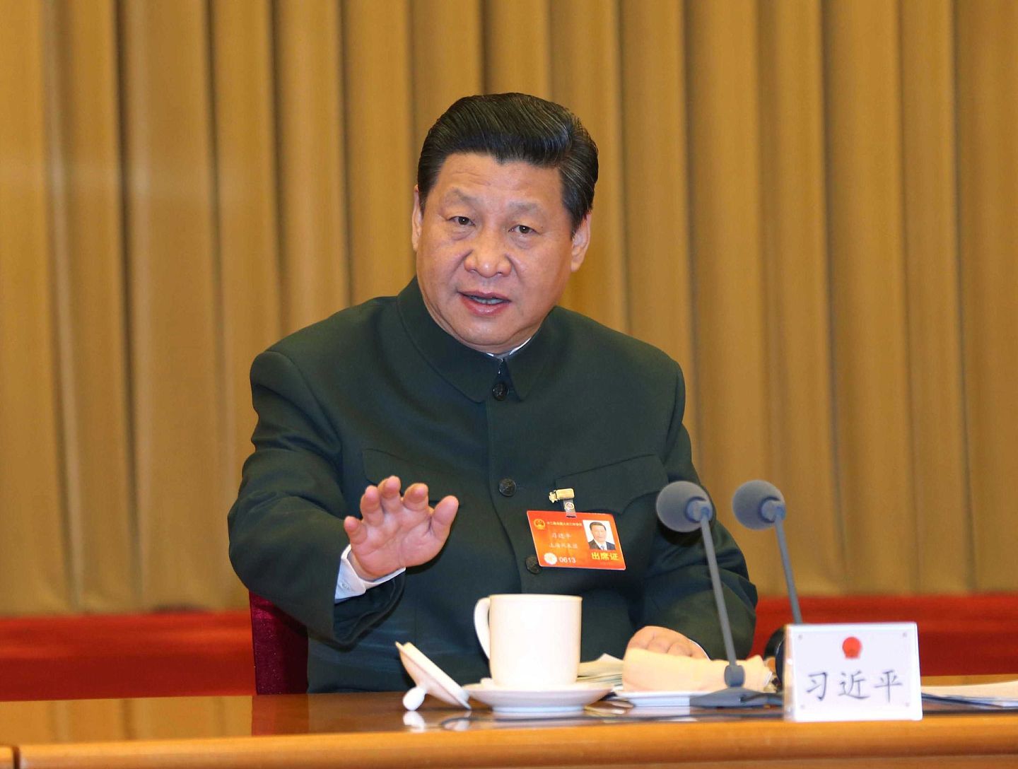 2014年3月11日，中国国家主席习近平出席十二届中国人大二次会议解放军代表团全体会议。（新华社）