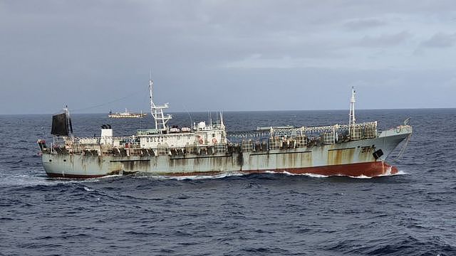 One vessel, part of a fleet of hundreds of Chinese fishing boats, sails in Pacific Ocean international waters near Chile