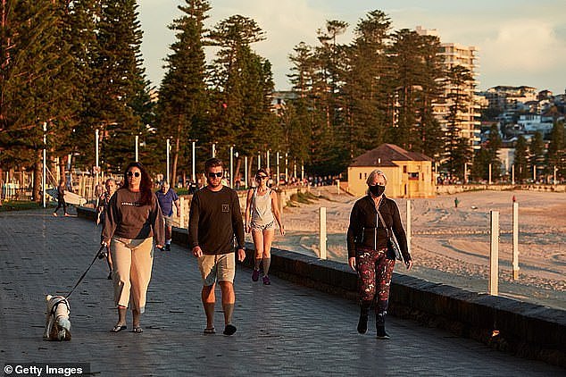 37165178-9080975-Residents_are_seen_exercising_on_Manly_beachfront_on_Wednesday_t-a-19_1608685518931.jpg,0