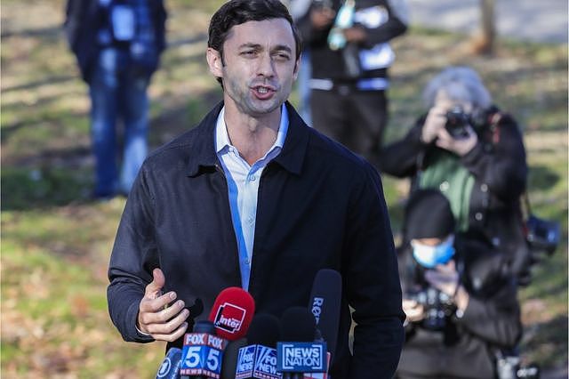 Jon Ossoff speaks to the media at the Dunbar Neighborhood Centre poling location in Atlanta, Georgia, USA, 5 January 2021