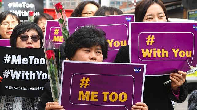 South Korean demonstrators hold banners during a rally to mark International Women