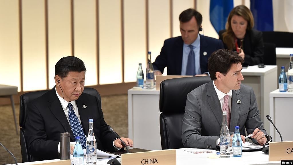 资料照片：中国领导人习近平与加拿大总理特鲁多在日本大阪举行的G20峰会上。（2019年6月29日）