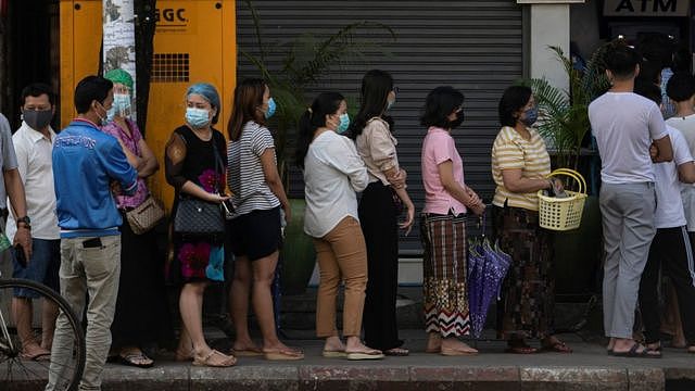 People line up outside a bank branch in Yangon, Myanmar, 1 February 2021.