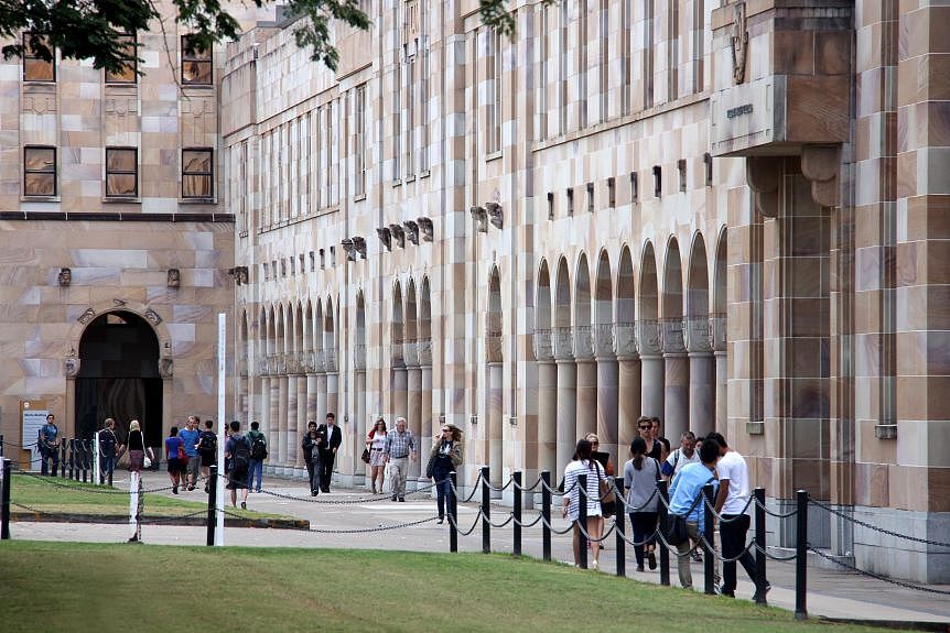 Students walk through the Great Court at the University of Queensland.