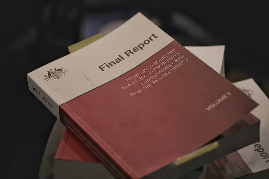 Three volumes of the banking royal commission final report stacked on top of each other