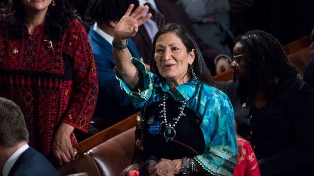 Deb Haaland waves