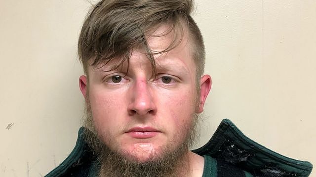 Robert Aaron Long, 21, of Woodstock in Cherokee County poses in a jail booking photograph after he was taken into custody by the Crisp County Sheriff