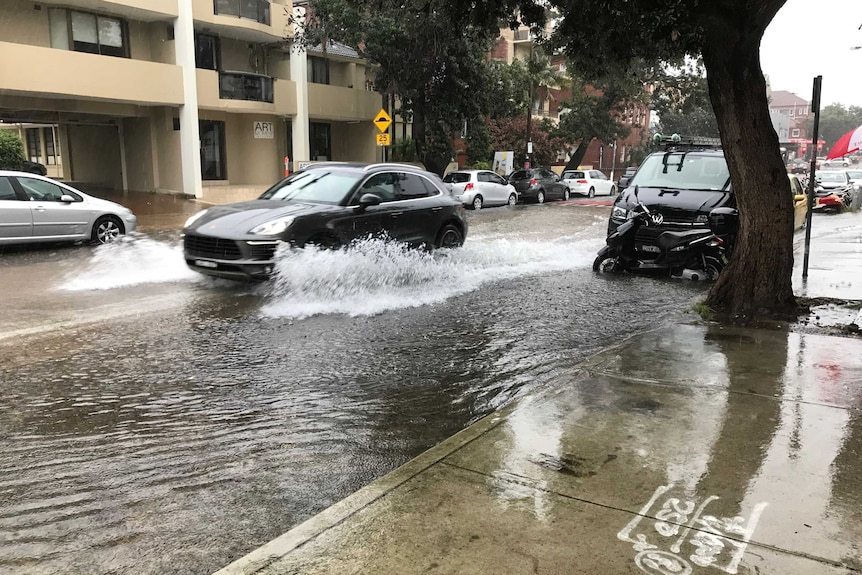 A car driving through a flooded road