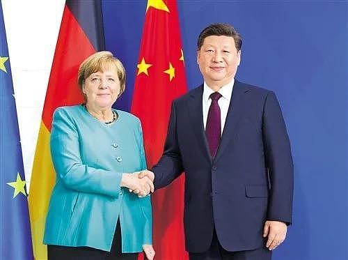 德国总理梅克尔（左）与中国国家主席习近平（右）。 图／取自新华社