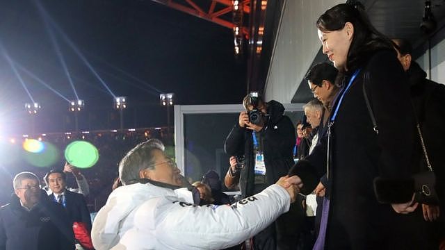 Kim Yo Jong (R, the sister of the North Korean leader) shakes hand with South Korea
