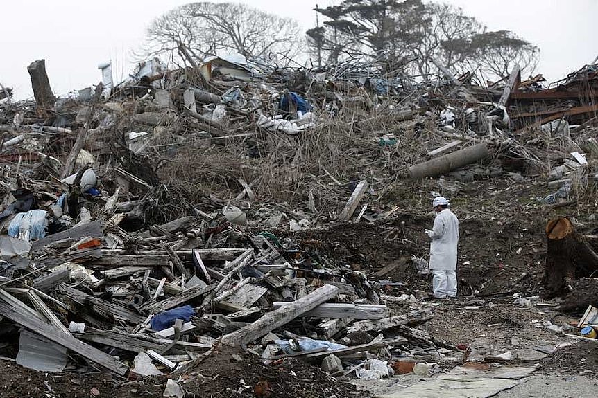 Norio Kimura, 49, who lost his father, wife and daughter in the March 11, 2011 tsunami, checks radiation levels on February 23, 2015.