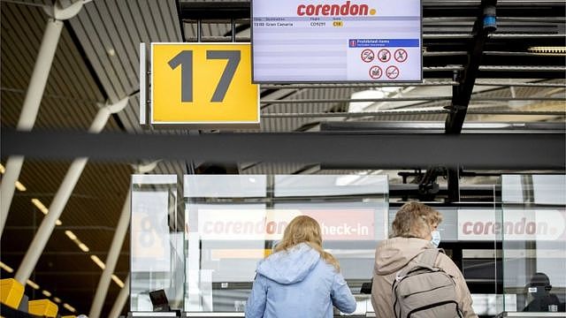 Tourists at the Schiphol Airport wait for their flight to Gran canaria, Spain, as they take part in the second Fieldlab trial holiday amid coronavirus pandemic in Schiphol, the Netherlands, 01 May 2021