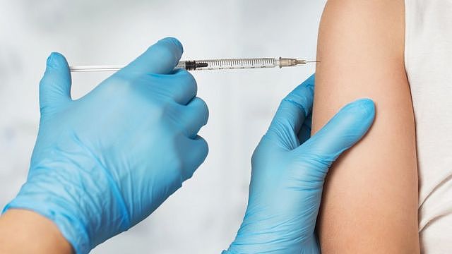 A child being given a vaccine