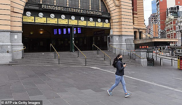 43550183-9627881-A_jogger_runs_past_a_near_deserted_Flinder_Street_Station_during-a-34_1622184372112.jpg,0