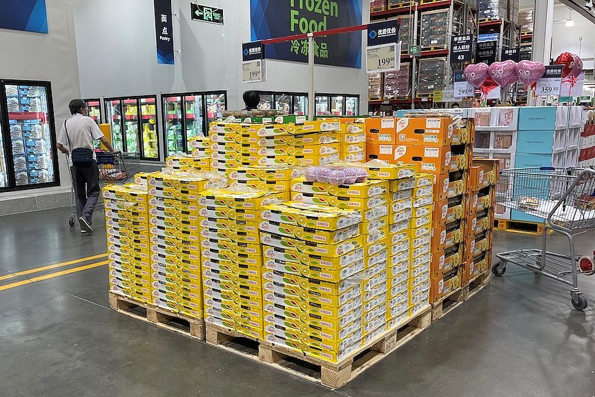 A stack of SunGold cartons on a supermarket floor. 