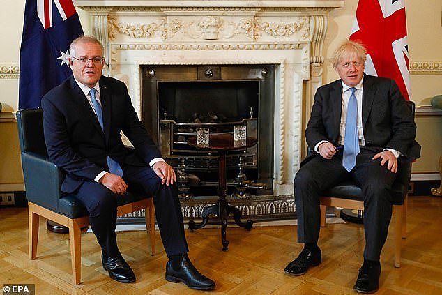 Scott Morrison and Boris Johnson (pictured together in London) announced the free trade deal on Tuesday