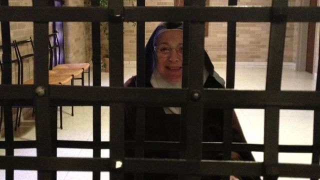Sister Mary Joseph behind metal bars