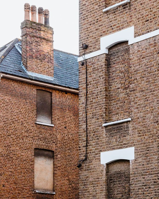Bricked-up windows on Hazlitt Road, London