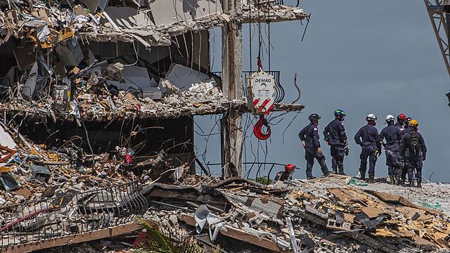 Search and rescue teams amid the rubble of the collapsed building