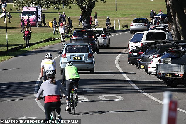 Locals described the scenes as 'chaos' with not even a single parking spot to be found in the massive parkland area. Centennial Park is a favourite for bicyclists, seen here