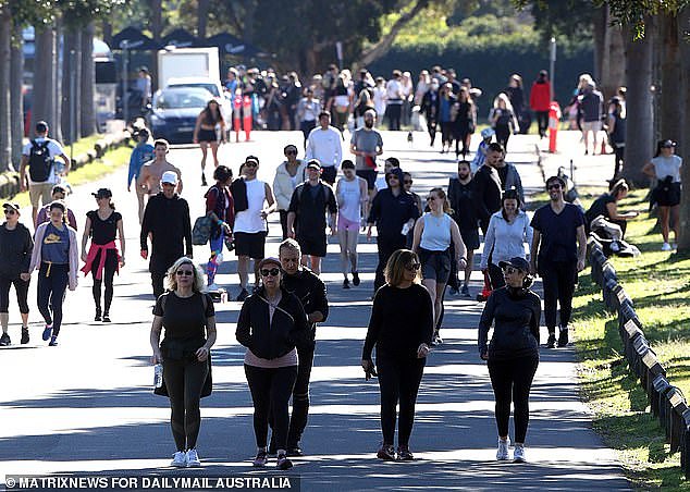 Surging Covid case numbers won't stop Sydneysiders from soaking up the sun in city parks and beaches, despite the pleas of New South Wales Premier Gladys Berejiklian. Seen here is Centennial Park in Sydney's Eastern Suburbs