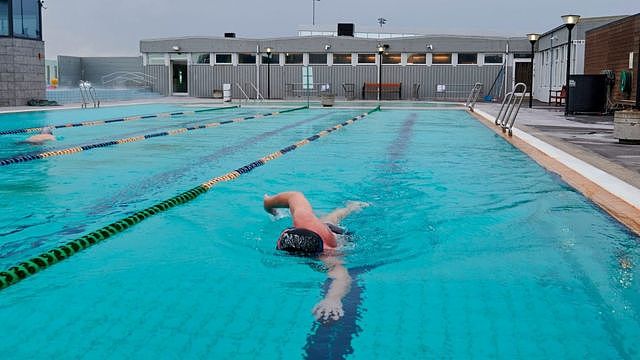 Man swimming in Seltjarnarnes, Iceland