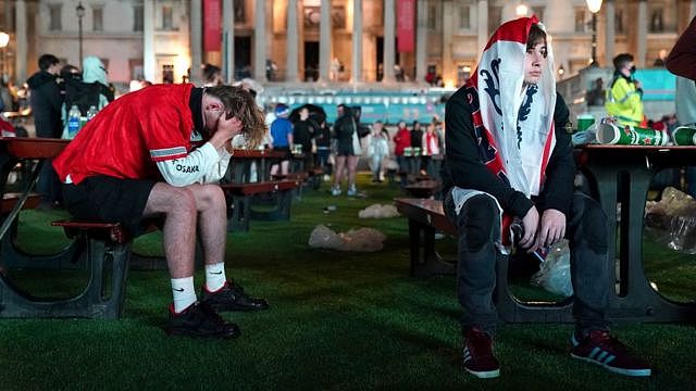 Fans after England lose the game on penalties at the Trafalgar Square Fan Zone in London