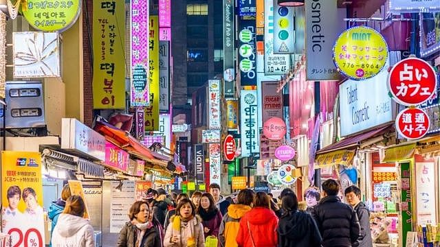 Crowds enjoy the Myeong-Dong district at night. The district is known as one of the main shopping and tourism areas.<br />Keywords Korea, Seoul, Korean Culture, Korean Ethnicity, South Korea, Street, Nightlife, Sign, Crowd, Myeong-dong, Downtown, Fashion, Night, People, Restaurant, Shop, 2015