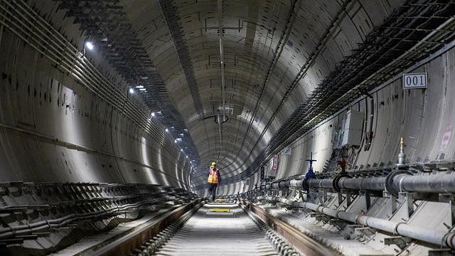 A worker walks in a tunnel at the construction site of a subway on December 18, 2020 in Zhengzhou, Henan Province of China.