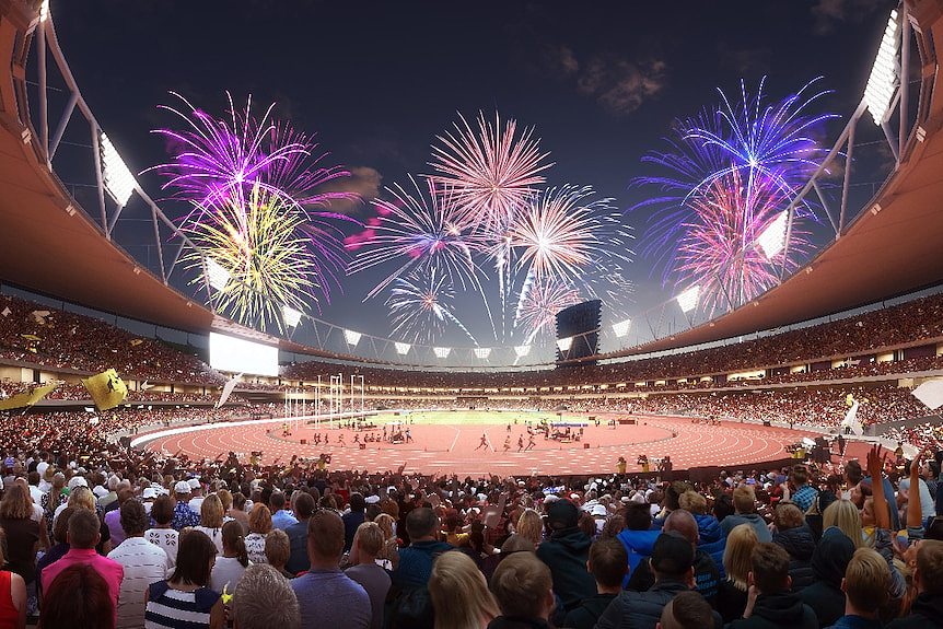 The inside of the stadium showing crowds, people on the field and fireworks.