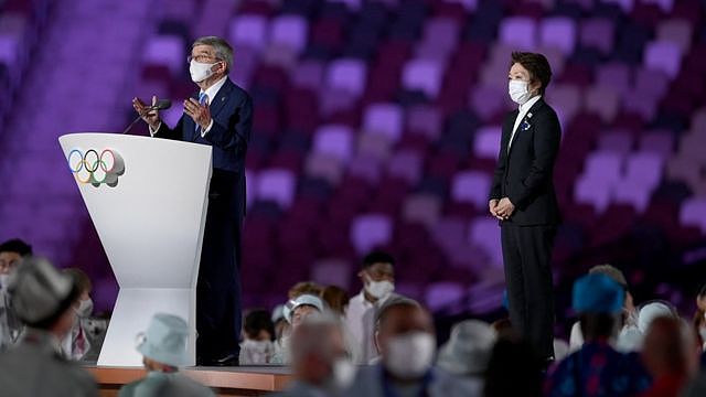 Thomas Bach, IOC President makes a speech as Seiko Hashimoto, Tokyo 2020 President looks on during the Opening Ceremony of the Tokyo 2020 Olympic Games at Olympic Stadium on July 23, 2021 in Tokyo, Japan.