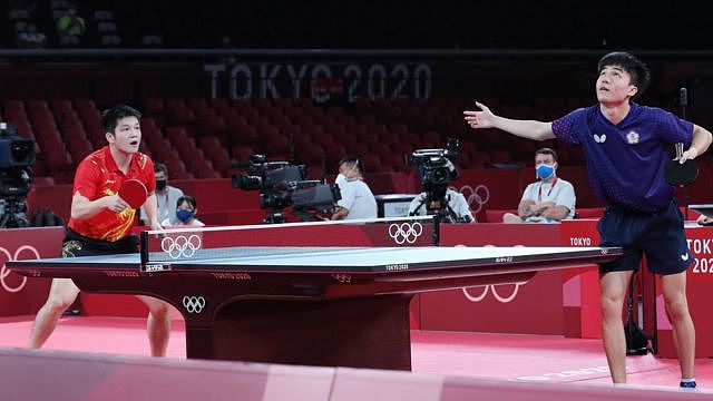 an Zhendong of China (L) in action against Lin Yun Ju of Chinese Taipei (R) during the Table Tennis Men