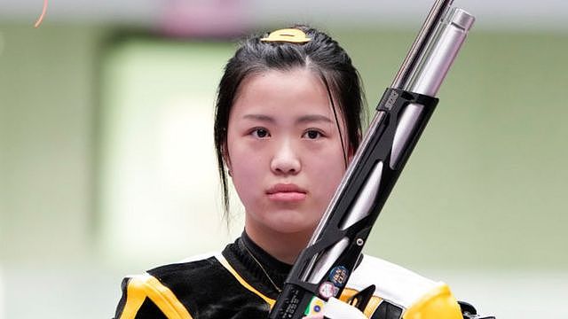 Yang Qian of China celebrates after winning the 10m Air Rifle Women's Final on the first day of the Tokyo 2020 Olympic Games