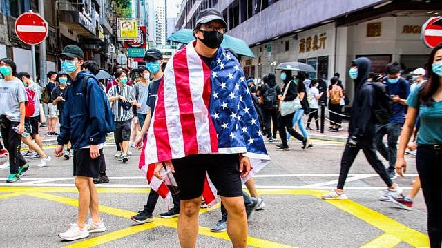 One Hong Kong protester is draped with the US flag during the 24th May 2020 protests.
